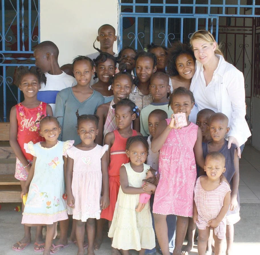 Amanda Schumacher with children served by the Foundation
